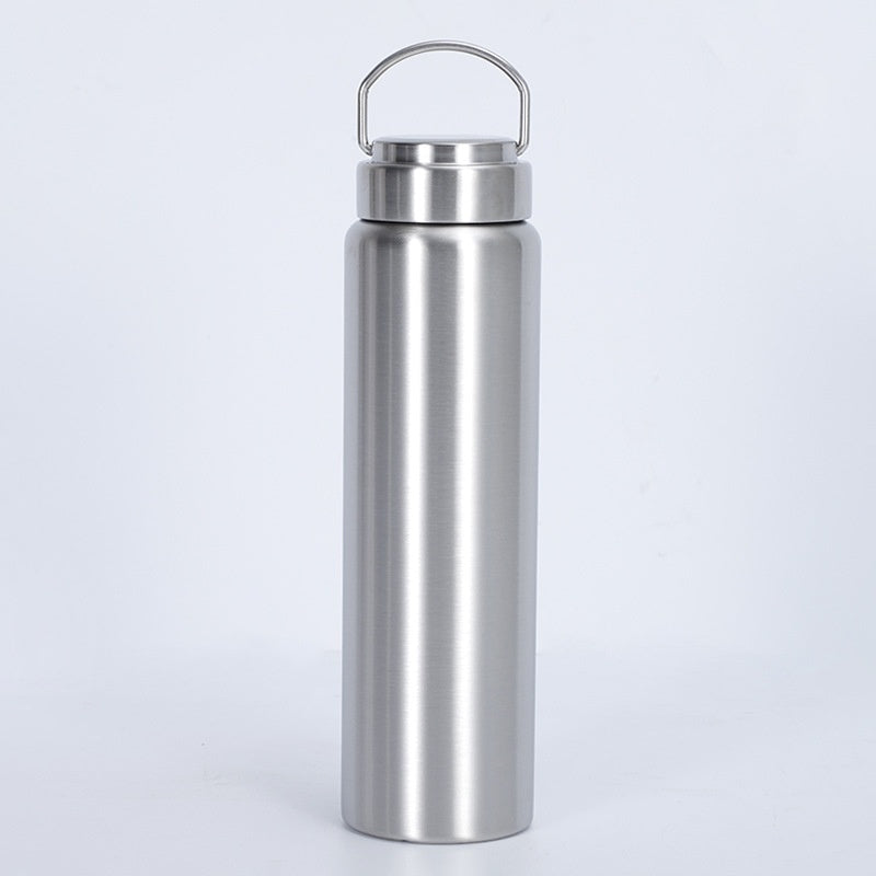 Upright stainless steel water bottle with a loop handle on its lid