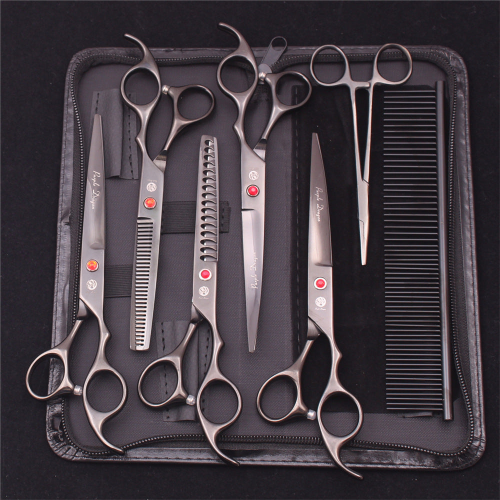 Silver dog grooming scissors and comb arranged in a black zip case
