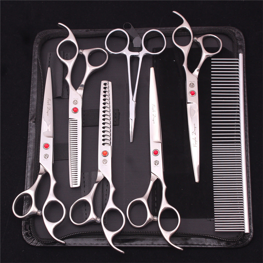 Silver grooming tools showing straight and toothed scissor blades
