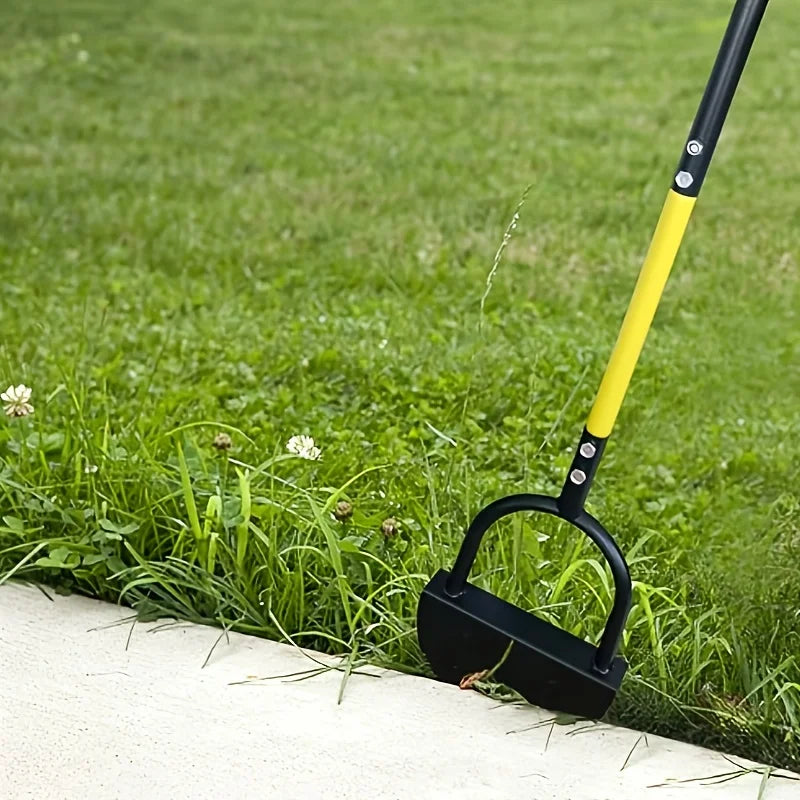 Black and yellow lawn edger positioned beside a concrete walkway