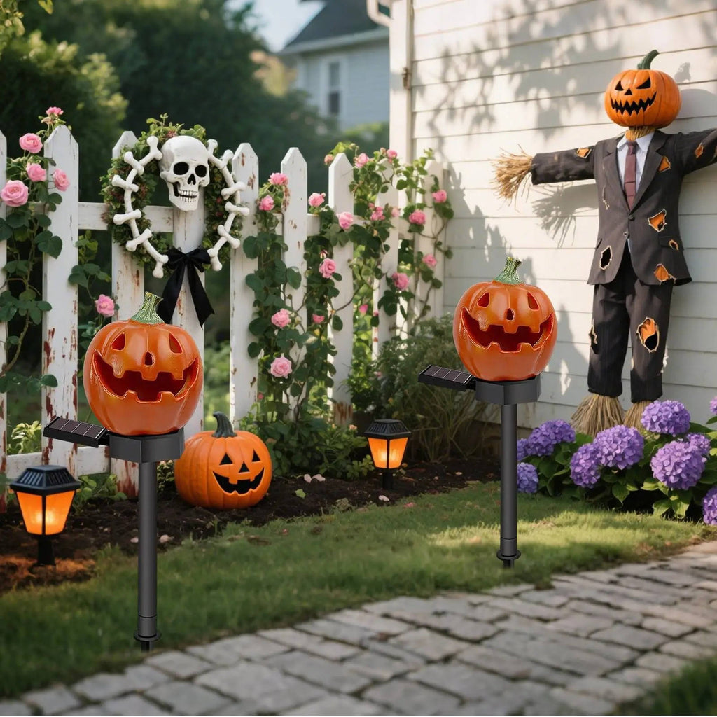 Pumpkin lights arranged beside a decorated porch