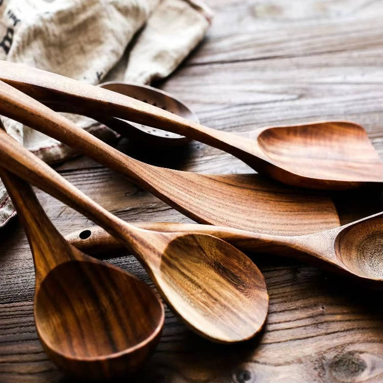 Close-up of polished teak utensils and natural wood grain