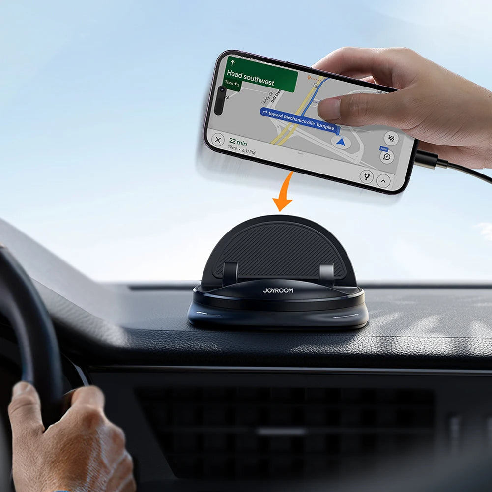 Hand placing a phone horizontally onto a black dashboard holder
