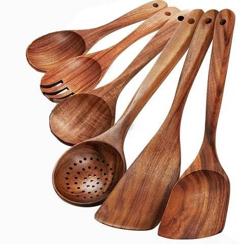 Teak utensil set showing spoons, fork, skimmer, and spatulas