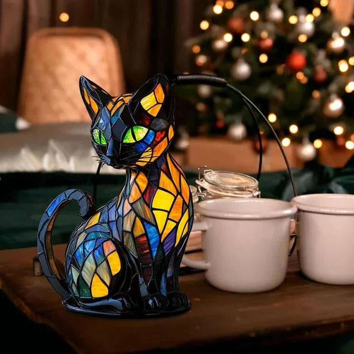 Cat-shaped accent lamp displayed beside a cup on a table