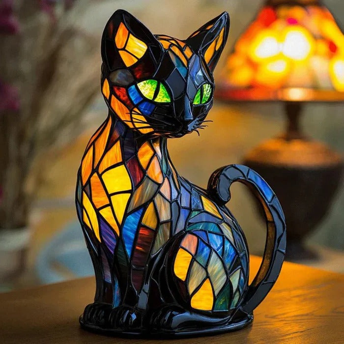 Illuminated cat-shaped table lamp with a colorful patterned body