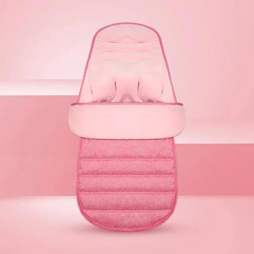 Pink stroller footmuff displayed against a pink background