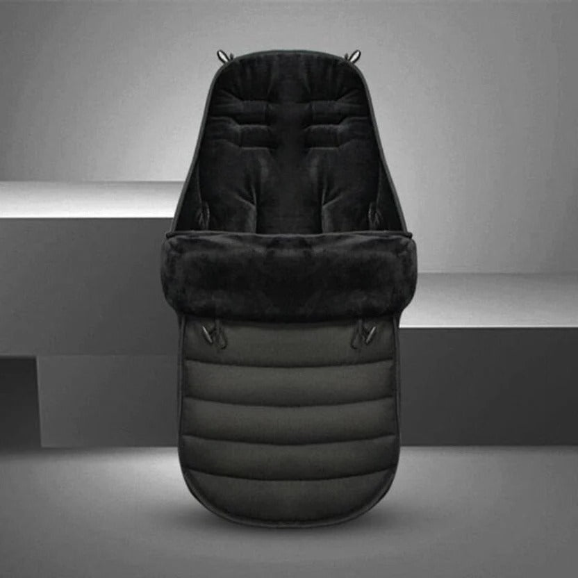 Black stroller footmuff displayed upright with its lining visible