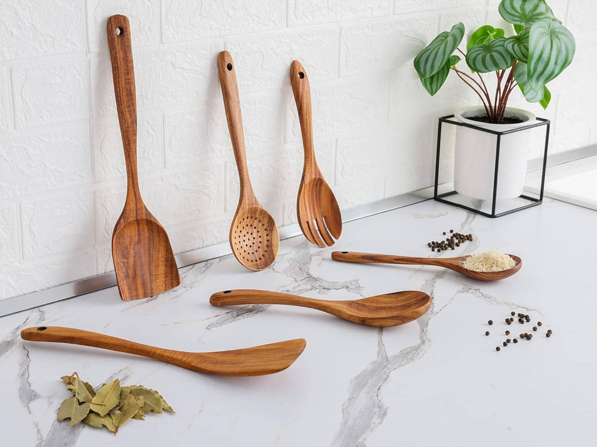 Wooden cooking utensils arranged on a kitchen counter
