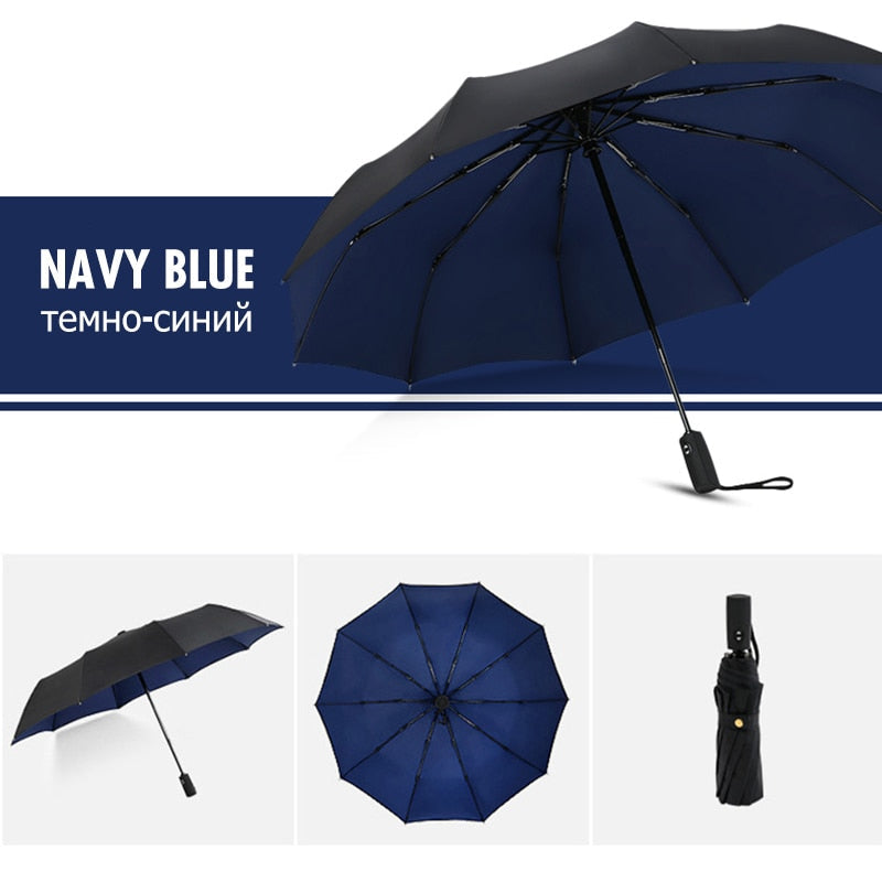 Navy folding umbrella shown open and packed