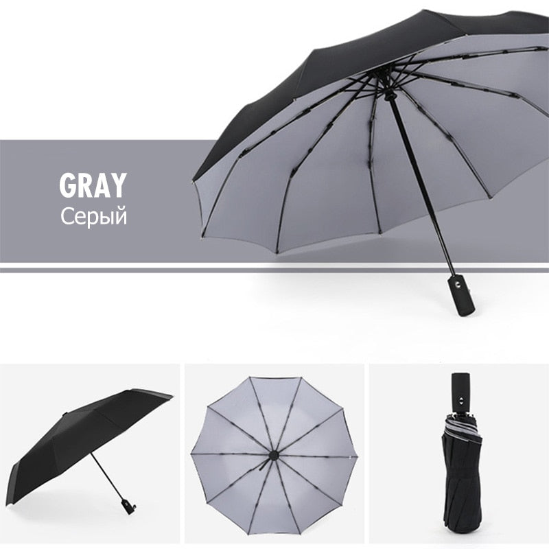 Gray-interior folding umbrella shown open and closed