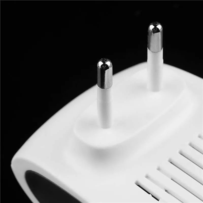 Close-up of two round plug pins on the back of a white pest repeller