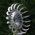 Metal kinetic wind spinner showing layered curved blades