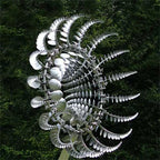 Metal kinetic wind spinner showing layered curved blades